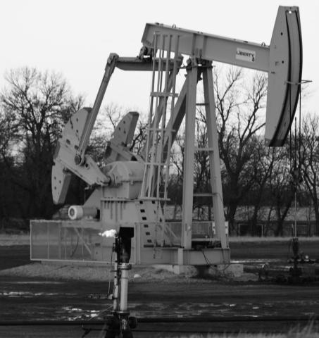 A gas flare burns in front of an oil pumpjack near Killdeer, North Dakota, on Feb. 1, 2024. copy.jpg
