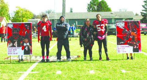 Bomber football seniors and their parents were recognized prior to Saturday's game. Pictured are seniors Trypp Castillo and Jerimiah Johnson with their parents. Photo by Jamie Rarick.