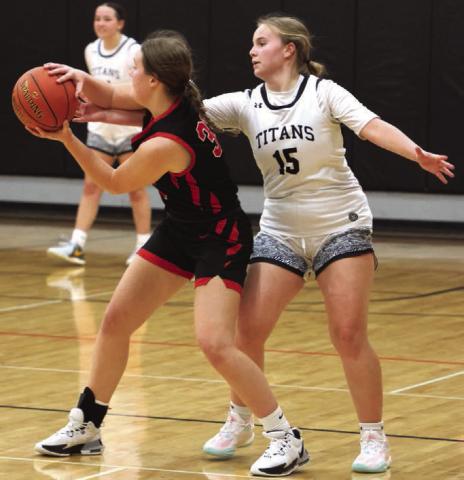 Aleah Pokrzywninski fights for control of the ball.