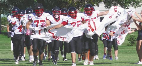 The Bombers take to the field to start the final regular season home game of the season. Photo by Lyle Van Camp