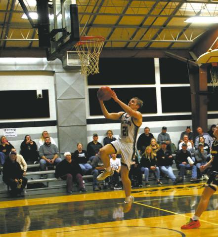 DVE sophomore Carter Oberg goes up for the basket. Photo by Jamie Rarick