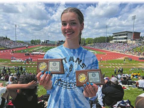 Elizabeth Fedji crushed the 24 year DPS standing record in the 400 dash. Photo by Jeryl Thompson