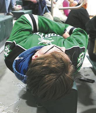 .J. Knutson takes a break from cheering for the Titans during halftime of the boys play-in game.