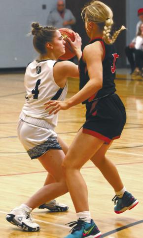 Greta Burrell looks for an open teammate in action against Midway Minto in Drayton last week. Photo by Lyle Van Camp