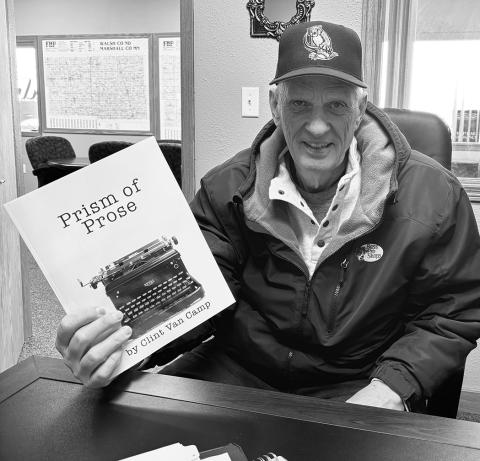 Clint Van Camp with his newly printed book, Prism of Prose. Photo by Andrea Johnston
