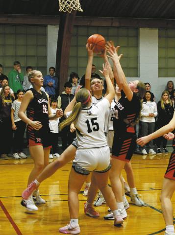 Titan Elizabeth Fedje battles to keep the ball following a rebound in Crystal on Feb. 7 against North Star. Photo by Jamie Rarick