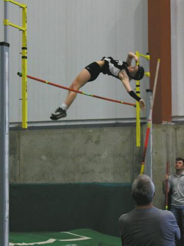 Clearing the bar, DVE junior Alyssa Hoyles finished 2nd for the day in Girls Pole Vault. Together with Minot North's McKinnley Kragh, a new meet record was set at 9' 9'. Photo by Jamie Rarick