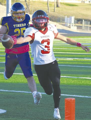 Trenten Bronson-Keena stretchs for the goal line as he scores one of his touchdowns. Photo by Lyle Van Camp