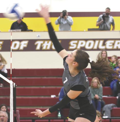 Elizabeth Fedje puts down a kill in regional tournament action Monday evening in Grafton. Photo by Lyle Van Camp