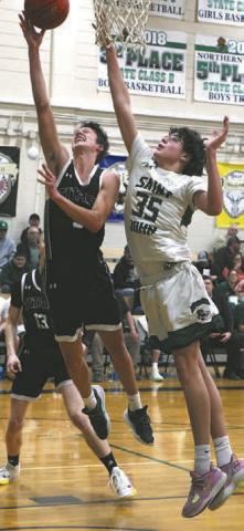 Jayse Gullickson shoots past St.John's Simon LaRocque.
