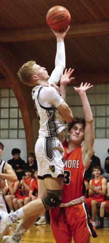 Connor Hurtt goes up for two against Larimore's Russell McLean.