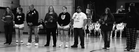 Seniors and their parents on Senior Night. From the left; Jessie Aasand, Kira Aasand, Mike Aasand, Andrea Douville, Isabella Douville, Justin Douville, Lacey Wherley, and Trinity Wherley. Photo by Lyle Van Camp.