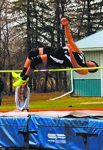 Mason Pollestad clears the high jump at the HCV meet, setting a new personal record at 5' 8'. Photo by Jamie Rarick