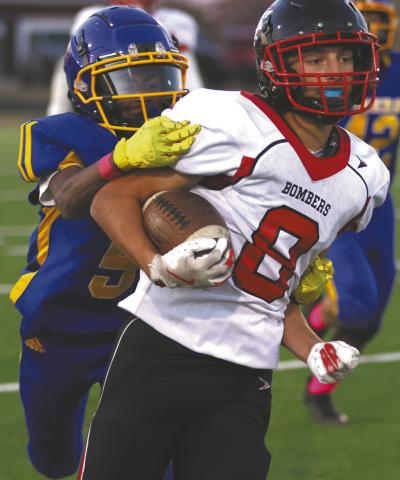 Carter Johnson breaks free from a Tigers defender. Photo by Lyle Van Camp