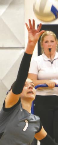 Elizabeth Fedje puts down a kill for one of the last points of the match. Photo by Lyle Van Camp