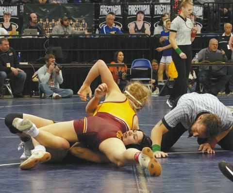 Drayton senior Alyssa Hoyles scores a nearfall against her opponent last week in Fargo. Photo by Larry Stokke