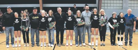 DVE seniors and their parents were recognized prior to Monday's game in Crystal. Pictured with their parents are seniors Brooke Gullickson, Alyssa Hoyles, Christine O'Toole, Elizabeth Fedje, and Raelyn Knutson. Photo by Jamie Rarick.