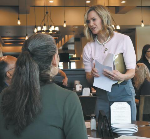 Rep. Julie Fedorchak, R-N.D., hands out informational packets on Trump Accounts during an event in Bismarck discussing the new accounts on May 11, 2026. Photo by Michael Achterling/North Dakota Monitor
