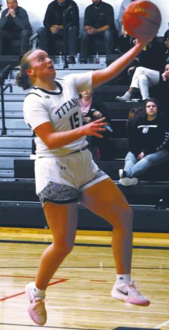 Aleah Pokrzywinski puts up a layup attempt against the Mustangs. Photo by Lyle Van Camp