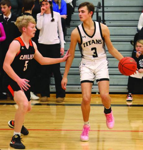 Calvin Otto tries to work past Cavalier’s Zack Anderson