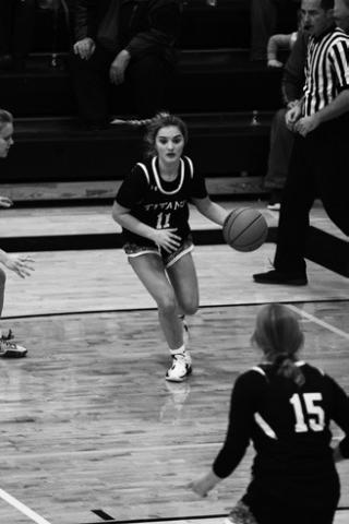 Park River-Fordville-Lankin's Hannah Halvorson (left) and Drayton-Valley-Edinburg's Elizabeth Fedje (right) jump for the ball at the beginning of last Thursday's game in Park River as D-V-E's Easton Larson (center) looks on. Photo by Mike Alan Steinfeldt.