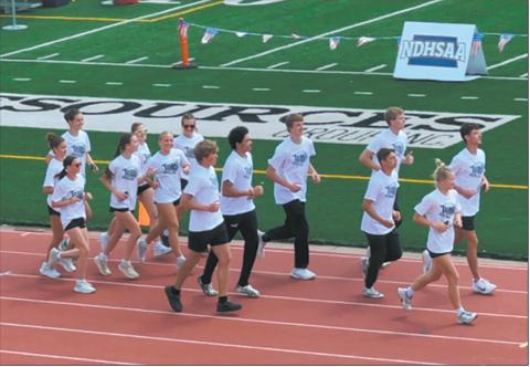 DVE Titans Parade of Athletes 2025 State Track and Field Meet from infield to track lanes, left to right: Elizabeth Fedje, Rosalyn Fedje, Milla Fagerholt; Greta Burrell, Jocelyn Vold; Violet Hoyles, Reese Fering; Jack Langerud, Mason Pollestad, Sam Kittelson; Carter Oberg, Carter Johnson; Brady Reilly, Alyssa Hoyles. Submitted photo