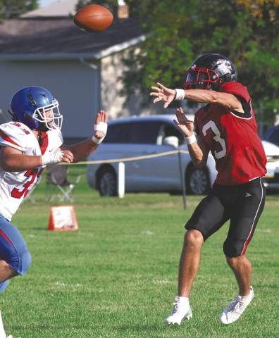 Trenten Keena gets a pass off before the defense can stop him. Photo by Lyle Van Camp