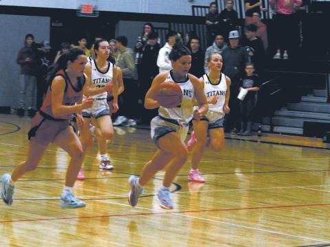 DVE junior Brooke Gullickson strips the ball and breaks away from the pack. Photo by Jamie Rarick