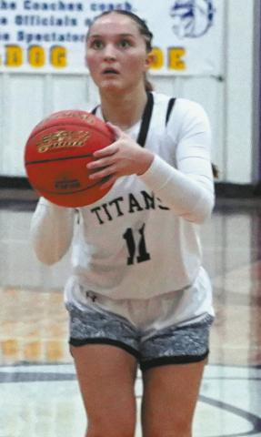 DVE junior, Jacey Nelson focuses on her three point shot during District play in Rolla. Photo by Larry Stokke