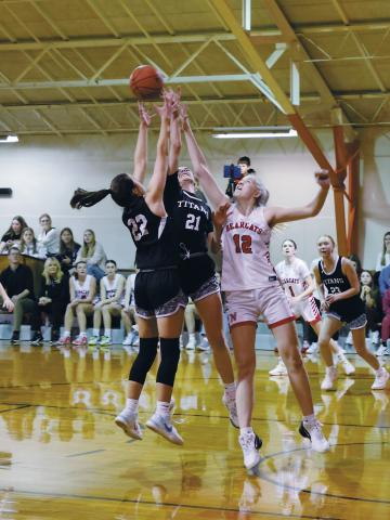 DVE's Jaelyn Johnson and Elizabeth Fedje fight North Star's Annabelle Staus for the rebound. Photo by Jamie Rarick