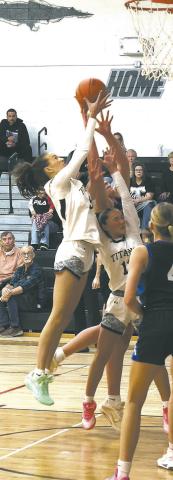 Fighting for the rebound on her home court Jan. 8, DVE's Gianna Hall comes out on top. Photo by Jamie Rarick