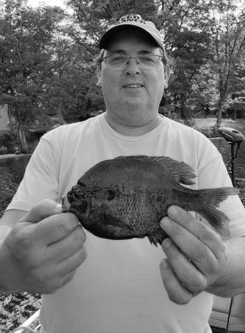 Mike Allen Steinfeldt with a blugill caught on the Namekagon river in Wisconsin.