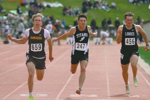 Brady Reilly, center, competes in the Boys' Class B 100 Meter Dash Preliminaries Friday. Reilly finished 13th overall in the preliminaries with a time of :11.38. Photo by Mike Alen Steinfeldt