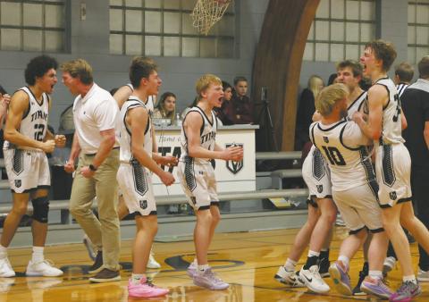 The DVE Titans celebrate following a come-from-behind win over the Langdon Cardinals with a last-minute shot. Photo by Jamie Rarick