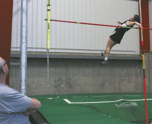 Alyssa Hoyles clears the bar on her way to tying the Titans indoor record.