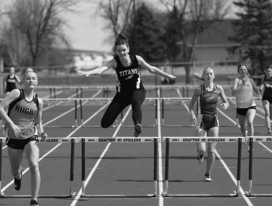 Elizabeth Fedje, center, placed sixth overall in the 100 meter high hurdles with a time of 18:39.