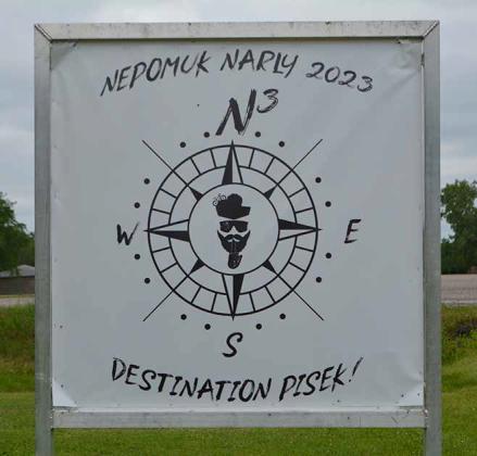 The Nepomuk Narly sign at the intersection of Walsh County 12A and County Road 15 marks Pisek as the venue for some of the best cyclists in the world to come and compete. Photo by Todd Morgan, Walsh County Record
