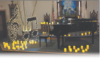 The sanctuary at Skjeberg Luthern Church in rural Drayton is illuminated by candles in preparation of the Power of Music concert. Submitted photo