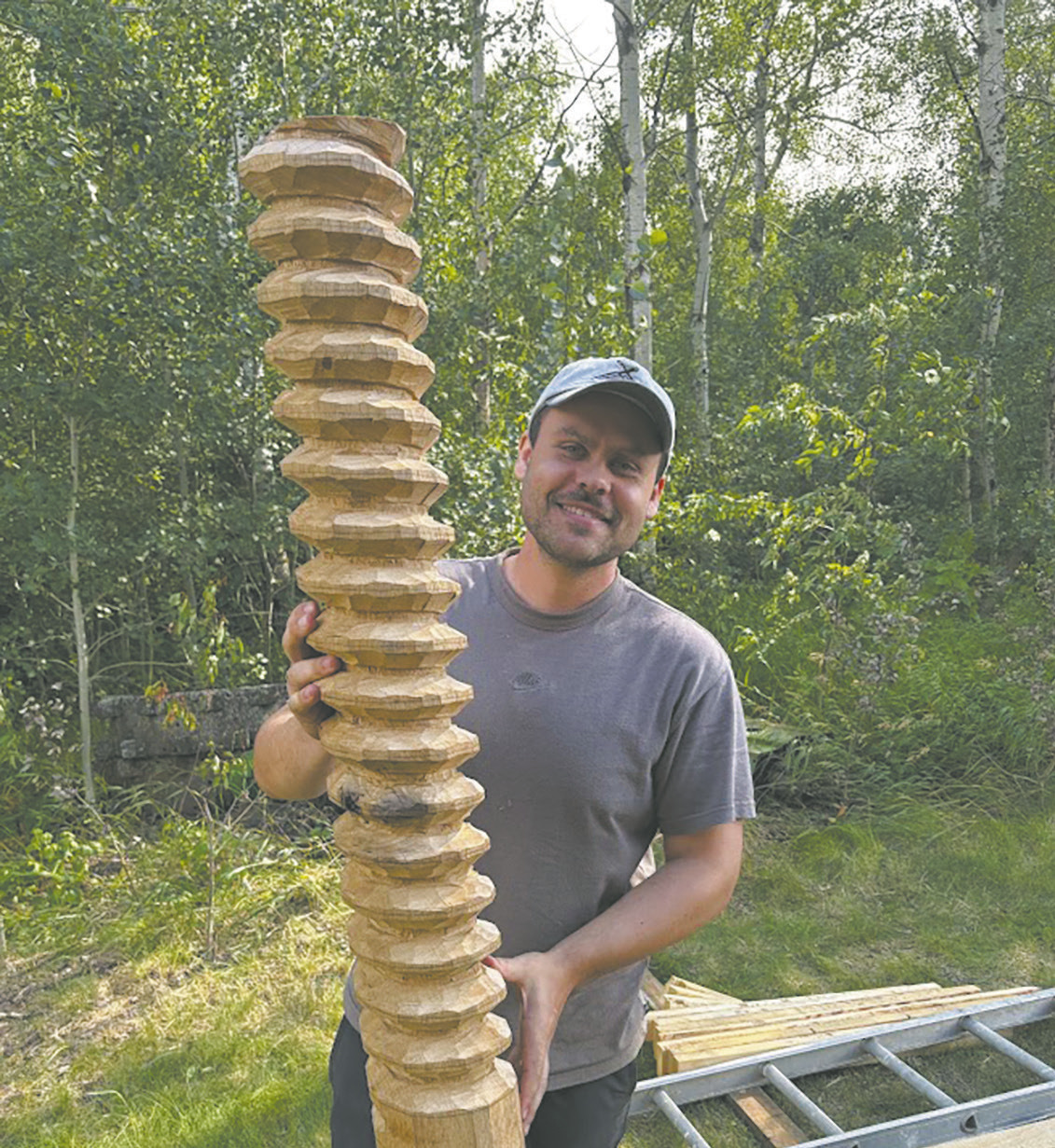Woodcrafter Talon Stammen with a partially completed wood screw for the apple cider press. Submitted photo