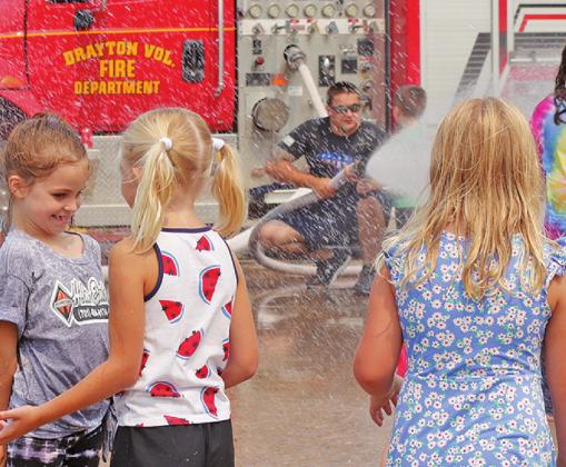 Saturday following the parade the Drayton Volunteer Fire Department brought smiles to the faces of the kids who played in the water during the hot weather. VNV Photo by Lesa Van Camp