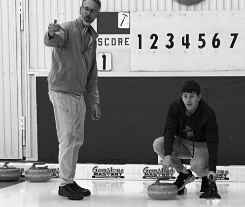 Christopher Longtin takes instruction from Tom Grzadzieleski. Photo courtesy of Pembina County 4-H