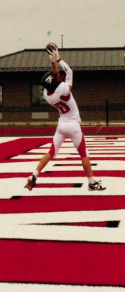 Leaping for the ball, Shawn Patterson makes a successful catch for an extra point conversion. Photo by Jamie Rarick