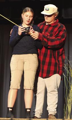 Rylee Maurstad and Bryce Wimpfheimer share a moment on the dock in the performance. Photo by Lyle Van Camp.
