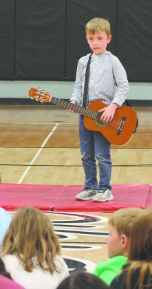 Mac entertains the crowd with his guitar. Photo by Jamie Rarick