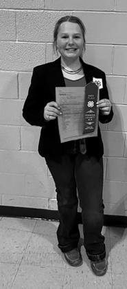 Senior speech, Bailey S is proud to display her blue ribbon. Submitted photo