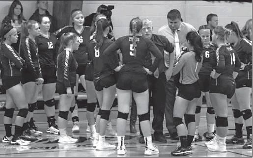 Coaches Tucker and Laxdal have a time out to talk strategy with the team. VNV Photo by Lesa Van Camp