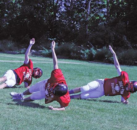 Members of the Bombers varsity team warm up at practice earlier this week. VNV Photo by Lesa Van Camp
