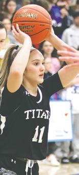 Jacey Nelson looks for an open teammate in the play-in game last Friday. Photo by Lyle Van Camp.