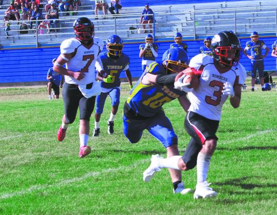 #3 Trenten Bronson-Keena eludes a defender while running down the field. Photo by Jamie Rarick