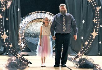 Ruth Rarick and her father Matt during the grand march. Photo by Lyle Van Camp.